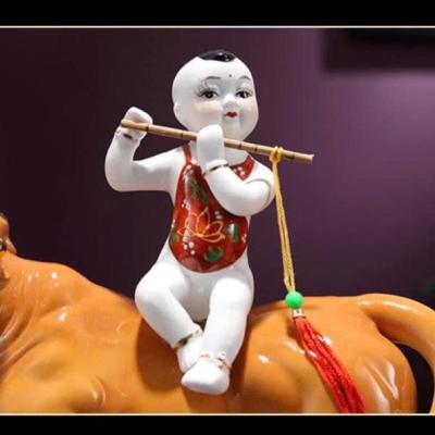 TƯỢNG SỨ TIỂU ĐỒNG CƯỠI TRÂU THỔI SÁO